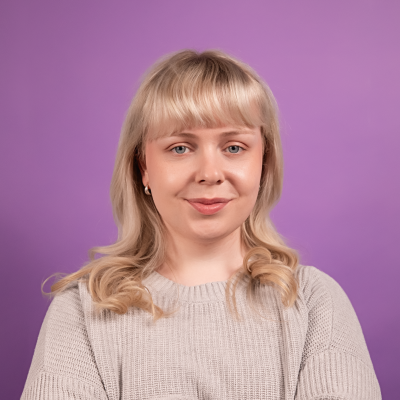 Blue Jumper Arms Crossed.png